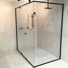 Black semi frame less shower screen with central door