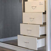White drawers with standard chrome handle.